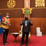 President Akufo-Addo with Samuel Takyi (middle) and the Sports Minister